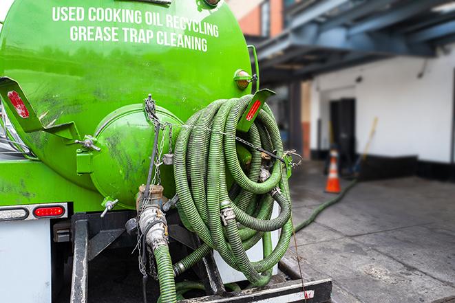 a pump truck emptying a grease trap in Baldwin Park, CA